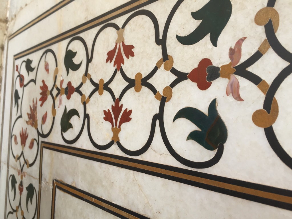 Close of up inlaid precious stones on the facade of the Taj Mahal